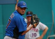 The 2011 spring training uniforms with the black lining on the sides underneath the arms. There is no patches on the sleeves. It has the writing in black with a white outline and orange shadow drop.