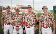 The military jersey with Cyclones in white. The BC on the cap in brown as the cap is grey with a mix of brown.