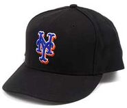 The black alternate cap used at home, road and with the black jersey. In 2012 it was worn on a few occasions. It was worn from 1999-2012.