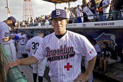 The Brooklyn Cyclones mascot salutes Airmen from Joint Base