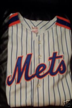 New York Mets Special Event Uniform (2013) - Los Mets scripted in blue with  a white outline on an orange uniform with blue piping, 2…