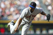 Manny Acosta wearing the two-tone cap. This was worn with the home, road and the black Mets wordmark jersey. It was worn from 1998-2011.