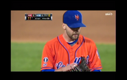 The 2014 "Los Mets" uniform which has the same design from the 2013 version. The Ralph Kiner and Frank Cashen patches are on the right sleeve and a Mr. Met patch on the left.