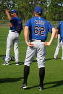 The 2007-2010 spring jersey where it has a orange colored area underneath the arms within the black lining. There is no patches on the sleeves. It also has the original Mets script, number and name on the back.