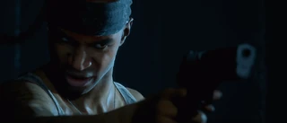 Hallucinating Junior points his gun at the heroes 