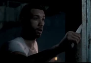 Alex wielding the kitchen knife.