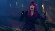 Mal on the bow of a ship during the song Stronger
