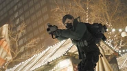 A Division agent aiming a Sticky Bomb Launcher.