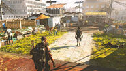 Division agents roaming around a fortified settlement.