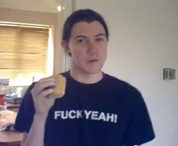 Nathan holding a sausage roll