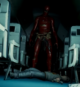 Red man (aka Dr. Matthew Cross) standing over Timmy