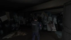 Inside the Yardie Drug Factory in The Getaway: Black Monday. The dead body of Suzie Hammond is also seen.