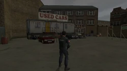 The Used Car Yard building seen in front of the Yardie Drug Factory.