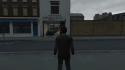 The entrance to the front yard of the Yardie Drug Factory seen from Holywell Row.