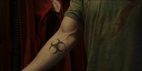 Trikru's symbol on August's arm