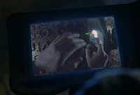 Colin Benson's hands is shown.