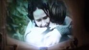 Katniss and Peeta hug