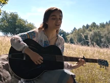 Lucy Gray composing "The Hanging Tree" in the Meadow.
