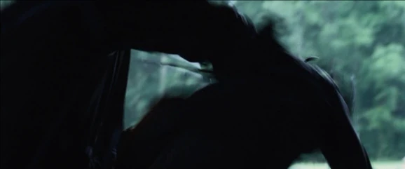 The District 5 male smashes the District 6 male's head into a crate.