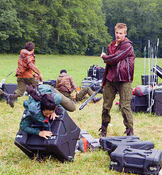 Cato hits the District 4 female with a bar mace