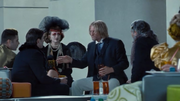 Haymitch talking to sponsors.