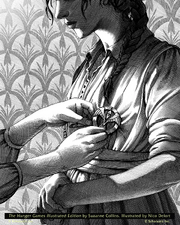 Katniss receiving the mockingjay pin in The Hunger Games: Illustrated Edition.