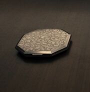 The silver compact in The Hunger Games: The Ballad of Songbirds & Snakes