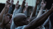 District 11 returning Katniss's salute.