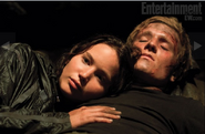 Katniss with Peeta in cave