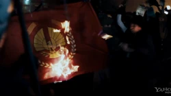The Capitol emblem being set on fire.