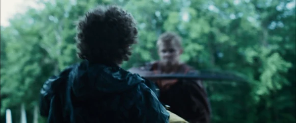 The District 4 male about to get hit with a bar mace by Cato.