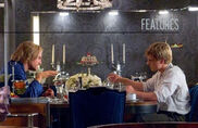 Peeta and Haymitch at the table