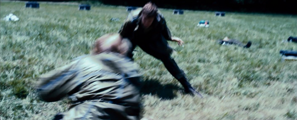 Marvel watches Glimmer insert a knife into the District 6 female.