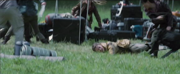 Cato brawls with the District 4 female (left) District 7 female ducks behind a crate (middle) District 5 male has just slashed the District 3 female's throat with a sickle