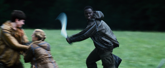 Thresh runs as the District 7 female and District 3 male fight for a backpack.