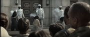 Three District 11 citizens being executed by Peacekeepers.