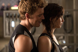 Finnick flirting with Katniss at the Training Center