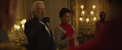 Presidente Snow y Egeria brindando.png