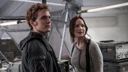 Finnick with Katniss in the Capitol