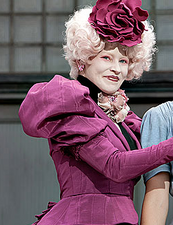 Effie with Katniss Everdeen following her sister's reaping.