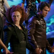 The District 10 tributes holding hands with the other victors