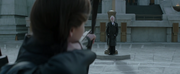 Katniss aims to shoot Snow.