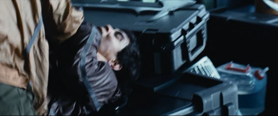 District 6 male strangles the District 5 male.