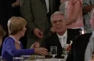 Mr&MrsLawrenceWainberg.webp (23 KB) Sid sit at table with Laura alongside above them Johnny, Ali Mils and her parents on dinner at the country club in “Karate Kid”