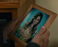 Sid looks at a photo of Laura in "Ace Degenerate"