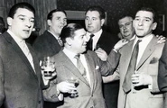 Ronnie (far left) and Reggie (far right) in an East End pub, with bodyguard Pat Connolly (centre, rear)