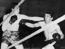 Ronnie (right), boxing as a young man.