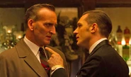 Christopher Eccleston as Read and Tom Hardy as Reggie in Legend, 2015.