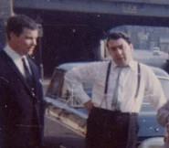 Colour photo of Teddy Smith and Ron Kray outside 178 Vallance Road, 1962.