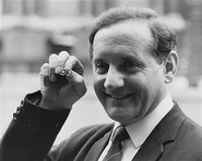 Policeman Leonard 'Nipper' Read, an Assistant Chief Constable in Nottinghamshire, pictured holding up a tie-pin in the shape of handcuffs as he is announced as National Coordinator of the Regional Crime Squad, at the Home Office, London, March 10th 1972.